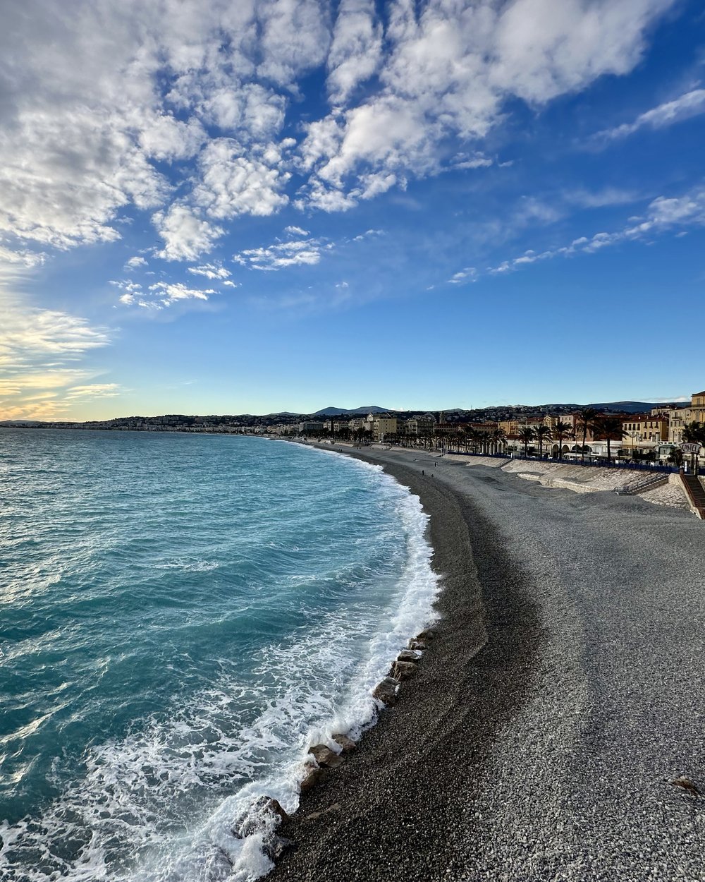 The Baie des Anges coastline in Nice, France, at sunset